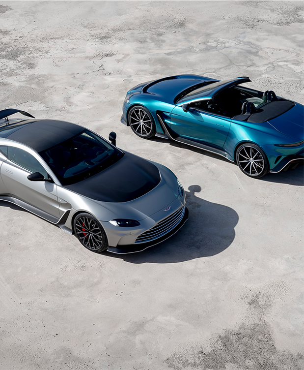Two Aston Martins side by side
